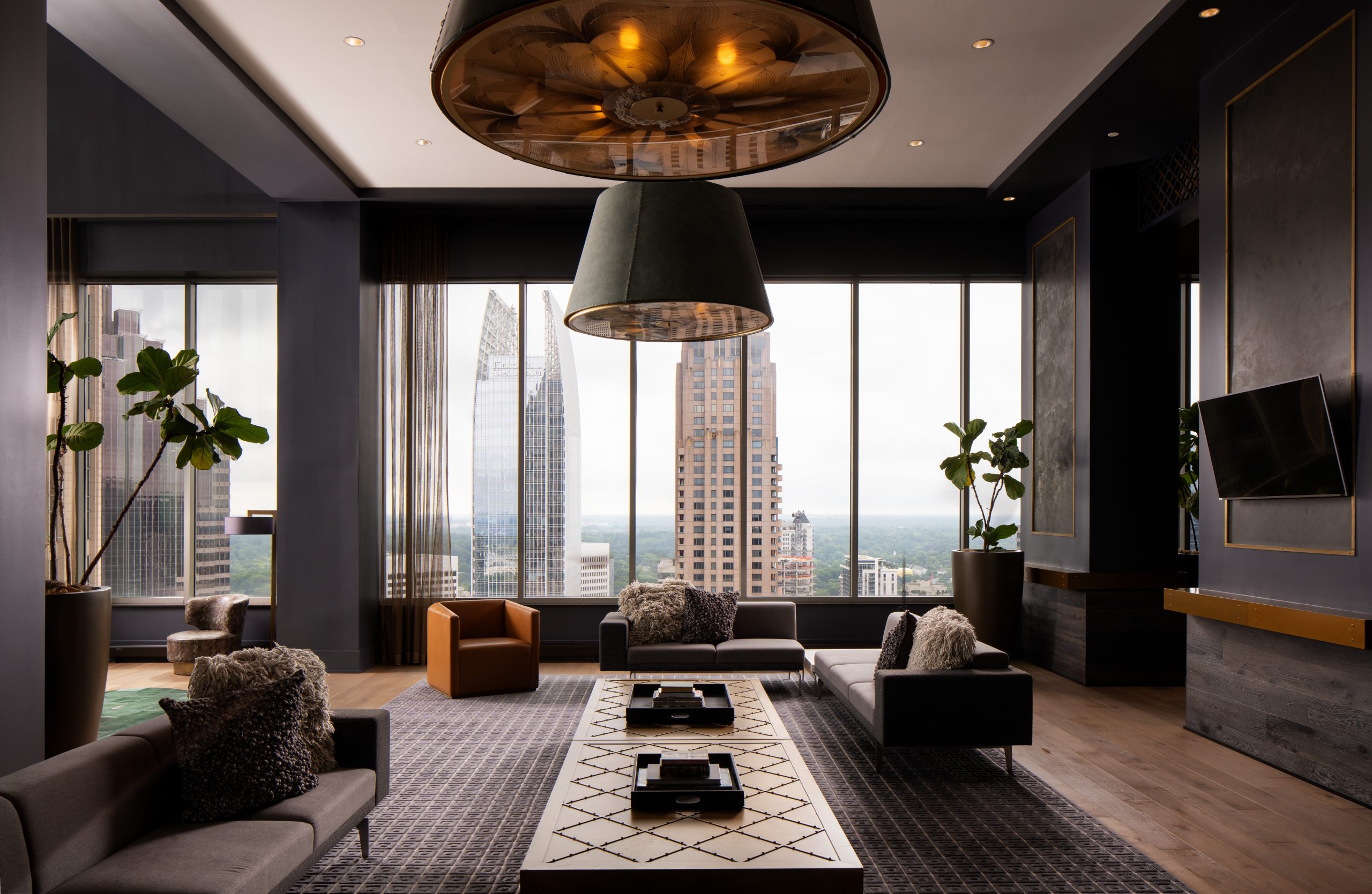 Hue Midtown apartments club room with floor to ceiling windows with views of Atlanta