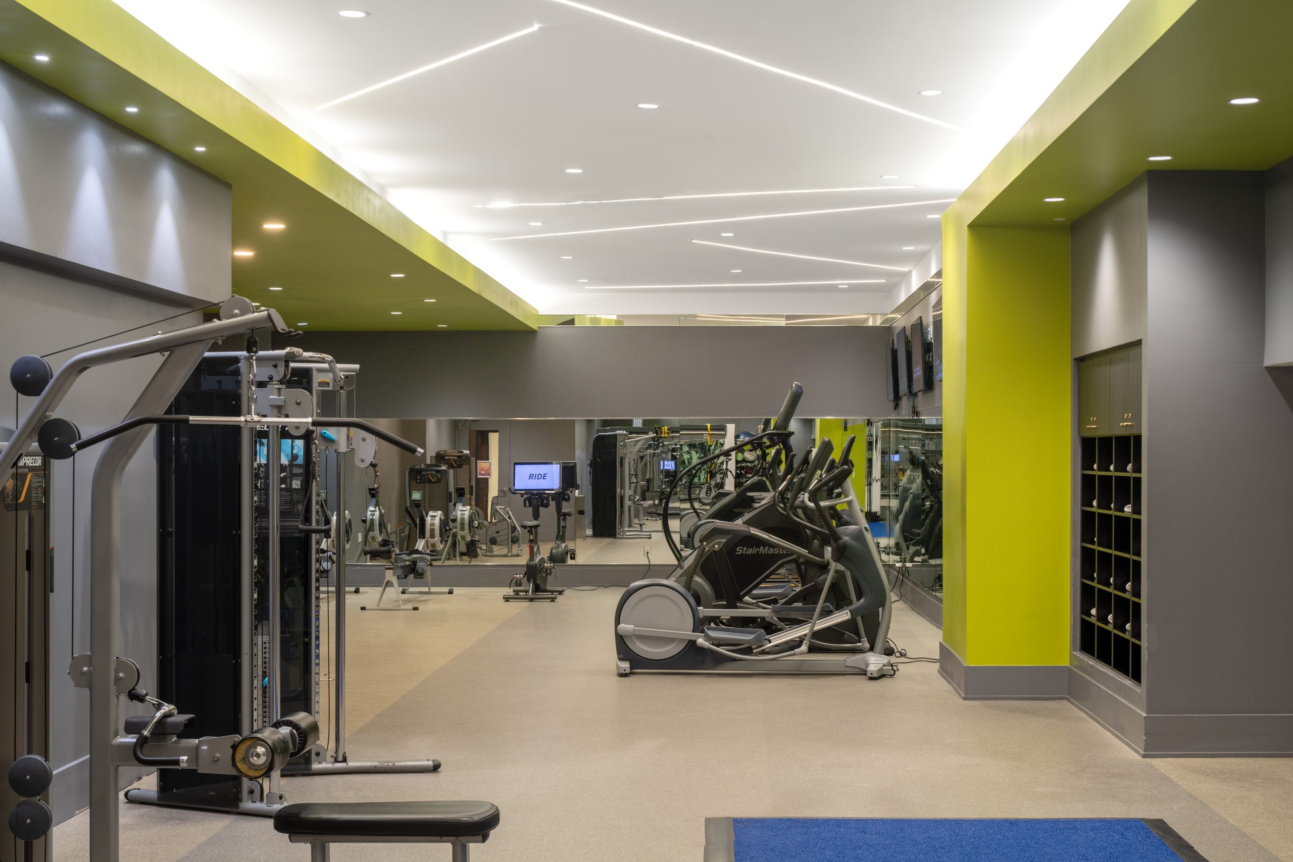 Fitness center featuring exercise machines at The Hue Midtown luxury apartments
