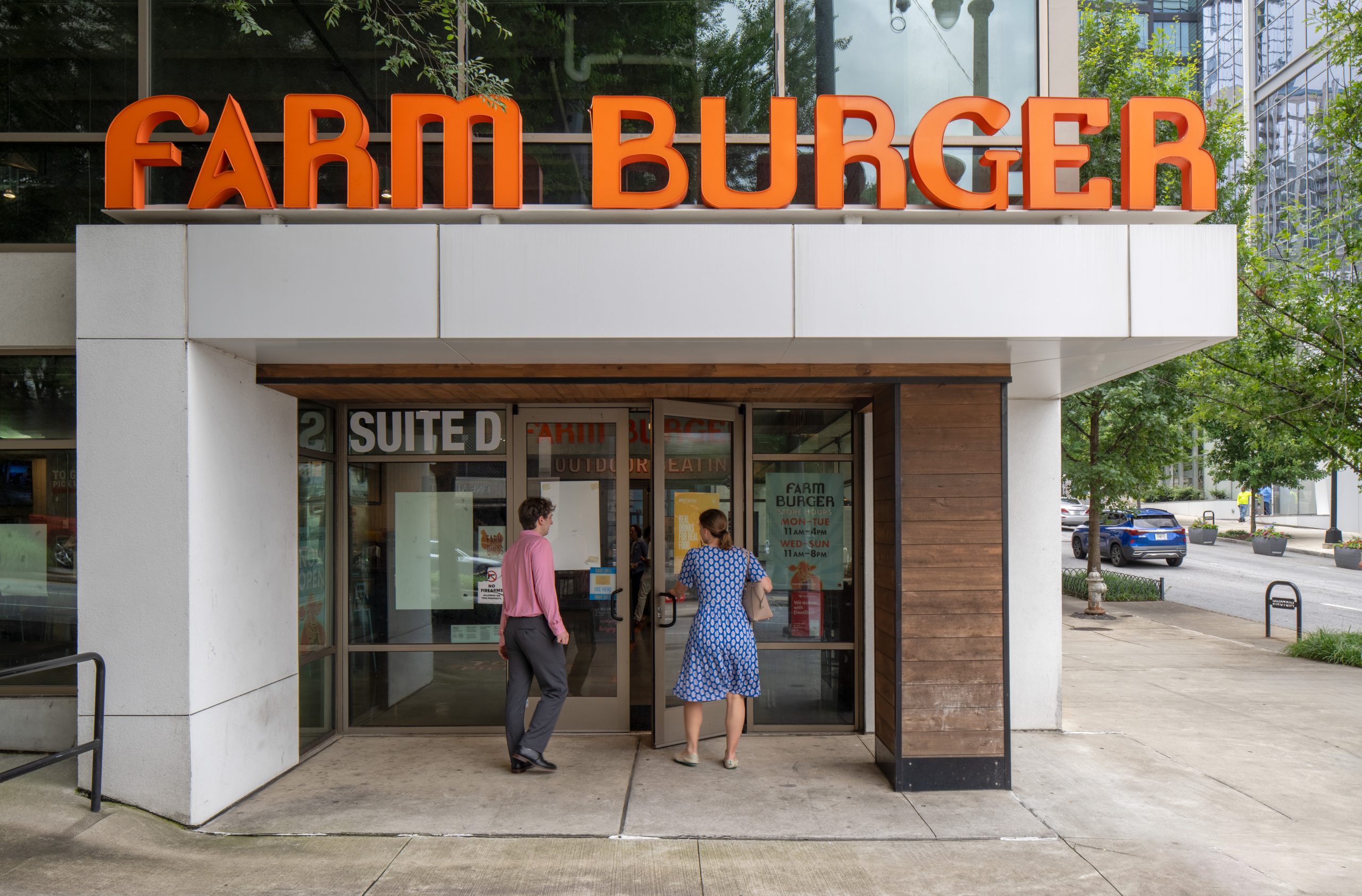 Farm Burger entrance at the foot of The Hue Midtown luxury apartments in Atlanta, GA