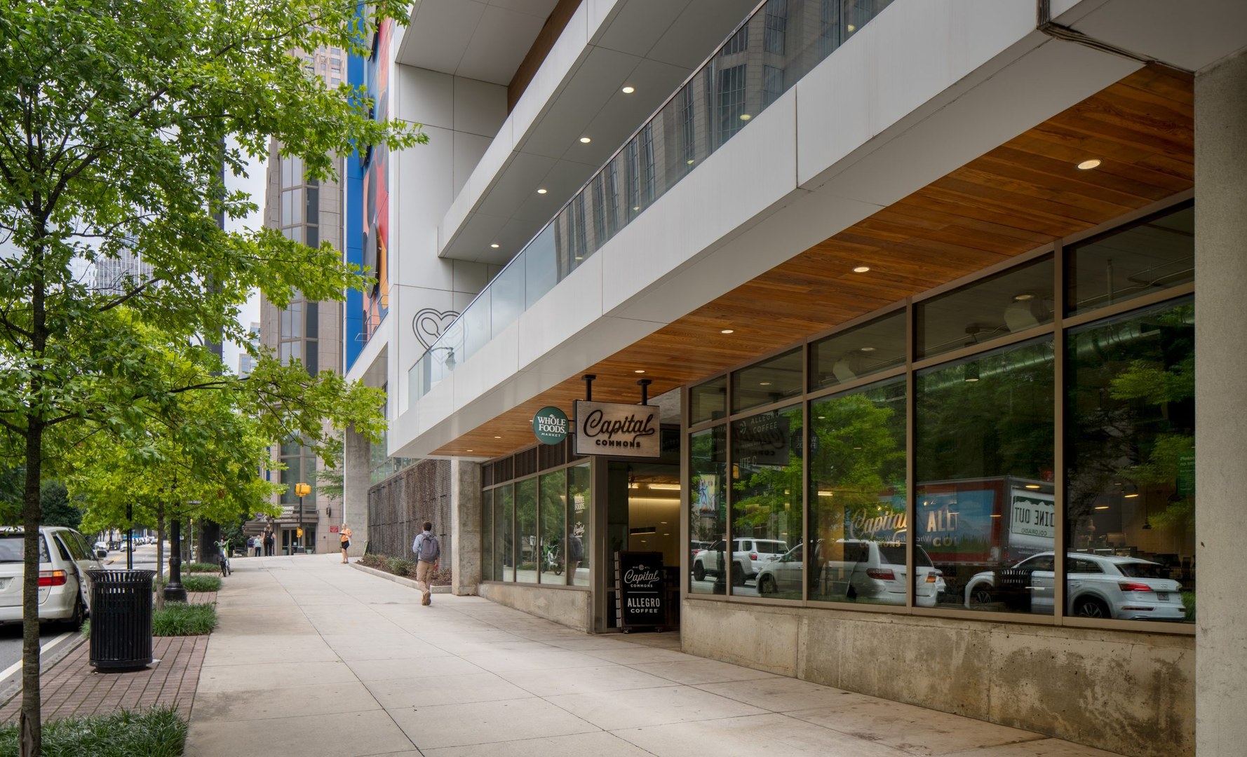 Whole Foods and other stores at the foot of The Hue Midtown Atlanta apartment building