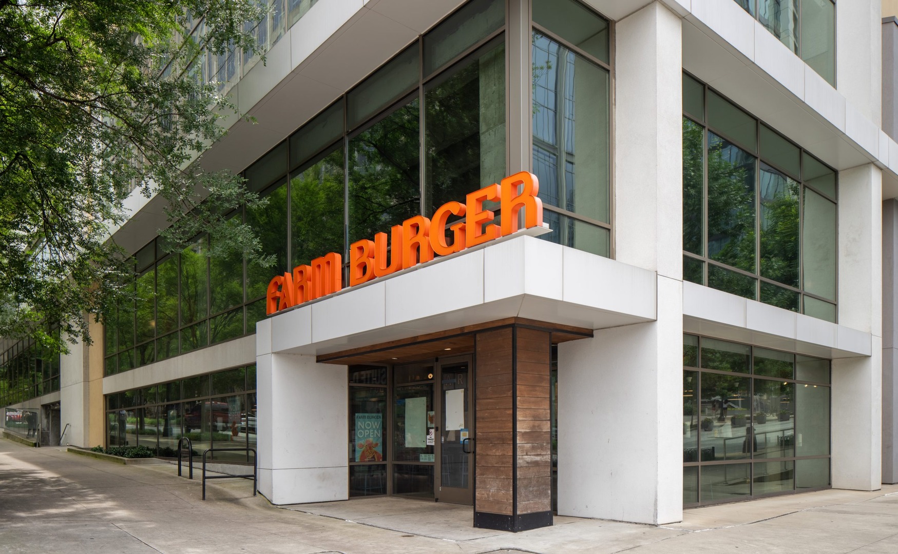 Farm Burger entrance at the foot of The Hue Midtown luxury apartments in Atlanta, GA