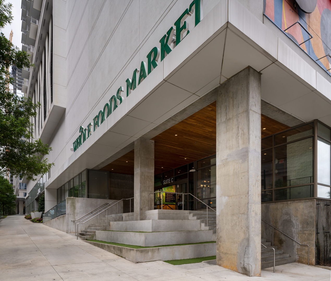 Whole Foods market entrance at the bottom of Hue Midtown luxury apartments in Atlanta