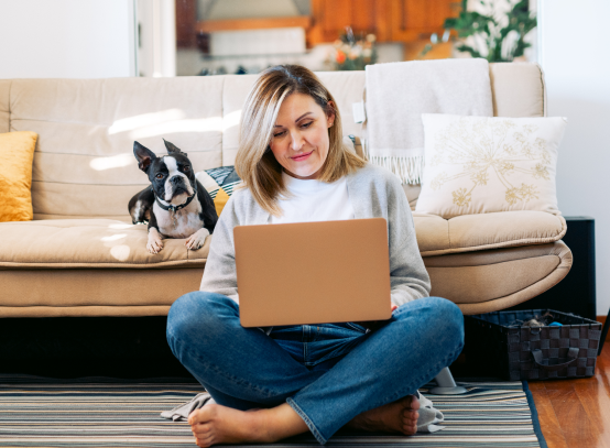 Woman with dog researching luxury apartments for rent in midtown Atlanta, GA